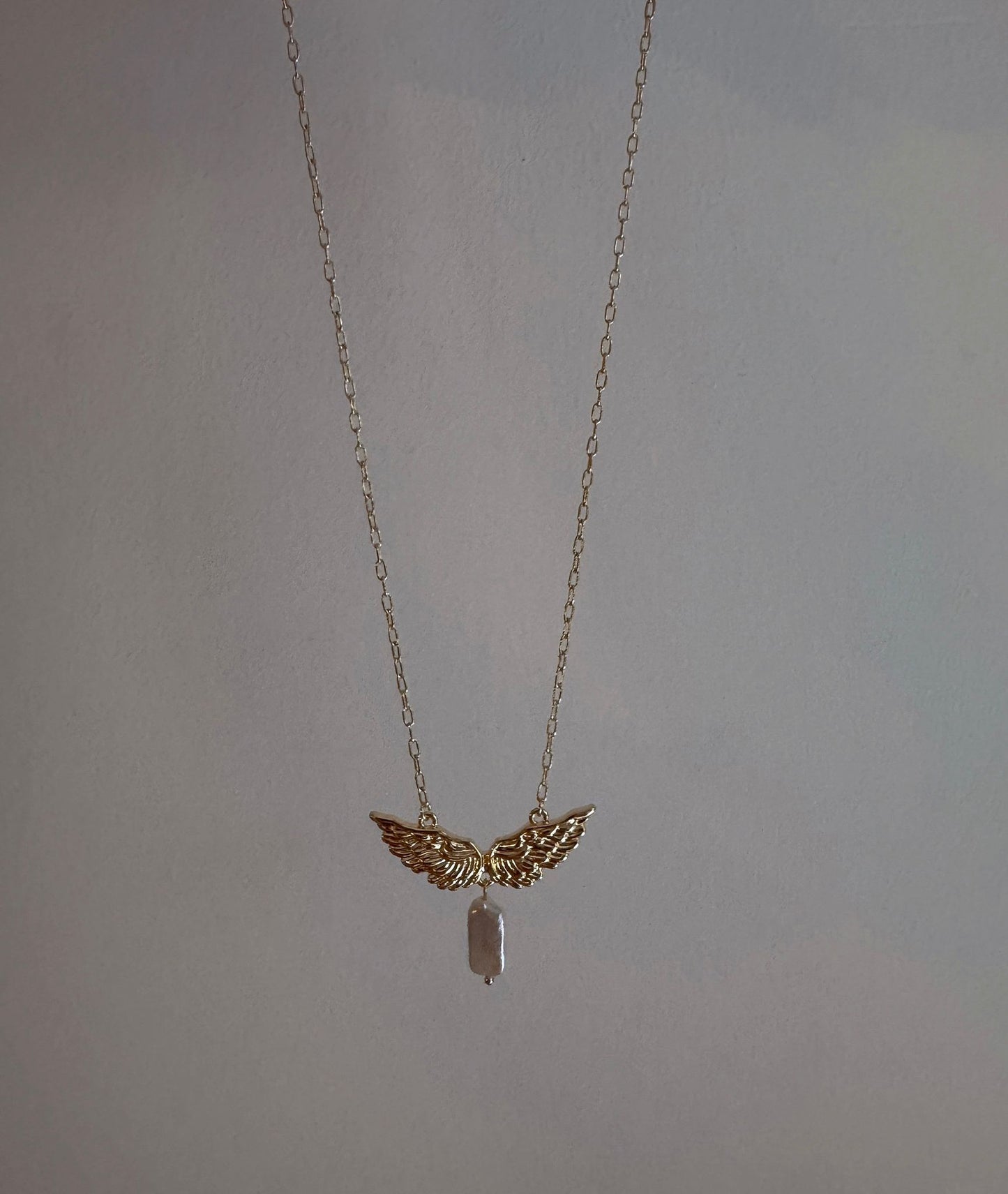 Under Shared Wings Pearl Necklace